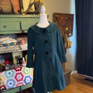 Chic Green Coat with Black Accents